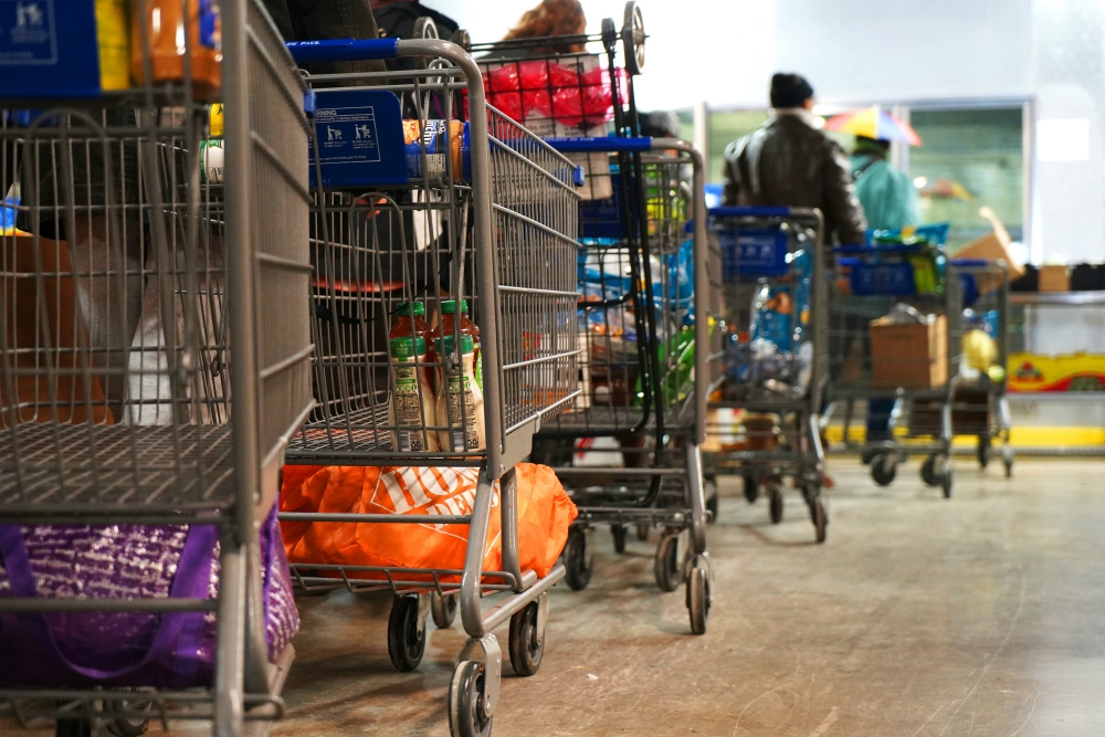 Shopping carts are slowly filled with food in November 2018 as clients make their way through the food pantry operated by the Indianapolis Council of the Society of St. Vincent de Paul. (CNS/Katie Rutter) Shopping carts are slowly filled with food in November 2018 as clients make their way through the food pantry operated by the Indianapolis Council of the Society of St. Vincent de Paul. (CNS/Katie Rutter)